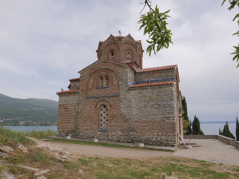 View of the historic Church of St. John at Kaneo with its stone and brick architecture situated on a cliff overlooking Lake Ohrid in Ohrid Municipality of Ohrid North Macedonia. View of the historic Church of St. John at Kaneo with its stone and brick architecture situated on a cliff overlooking Lake Ohrid in Ohrid Municipality of Ohrid North Macedonia.