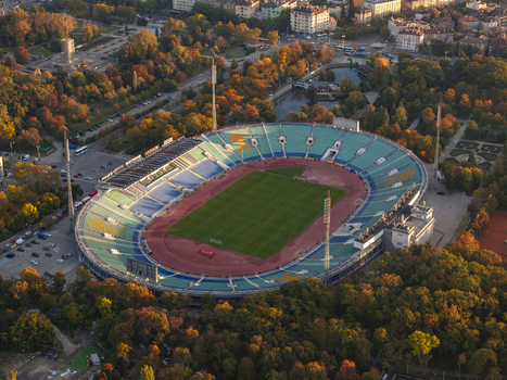 Aerial view of Vasil Levski National Stadium surrounded by autumn trees and urban parkland in Sofia Sofia City Province Bulgaria. Aerial view of Vasil Levski National Stadium surrounded by autumn trees and urban parkland in Sofia Sofia City Province Bulgaria.