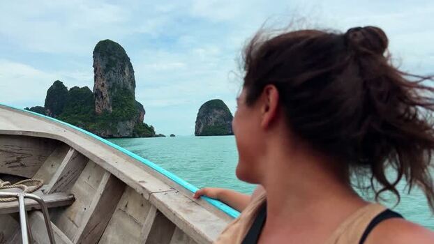 View of towering limestone karsts from a boat Thailand.