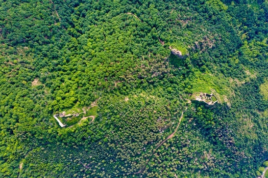 Aerial view of the historic castle ruins of Saint Ulrich and Girsberg nestled within the dense green forests of the Vosges mountains in Ribeauville Grand Est France. Aerial view of the historic castle ruins of Saint Ulrich and Girsberg nestled within the dense green forests of the Vosges mountains in Ribeauville Grand Est France.