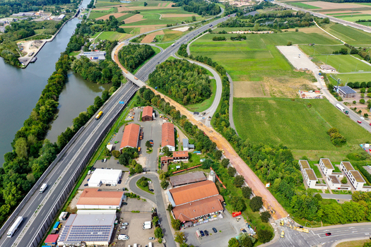 Forchheim Germany 02 May 2026 Aerial view of the A73 motorway junction and the Main Donau Kanal surrounded by industrial buildings and green agricultural fields. Forchheim Germany 02 May 2026 Aerial view of the A73 motorway junction and the Main Donau Kanal surrounded by industrial buildings and green agricultural fields.