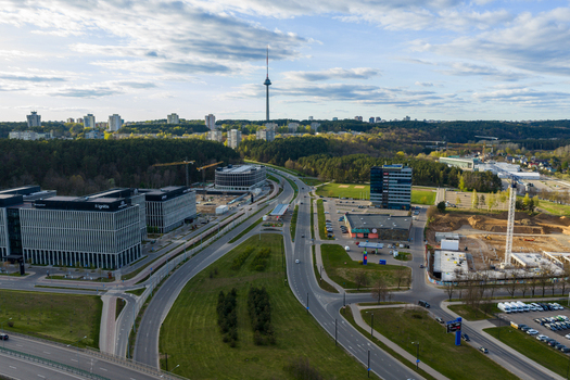 Vilnius County Lithuania 01 May 2026 Aerial view of the Vilnius TV Tower rising above the horizon with modern office buildings construction sites and lush green forests. Vilnius County Lithuania 01 May 2026 Aerial view of the Vilnius TV Tower rising above the horizon with modern office buildings construction sites and lush green forests.