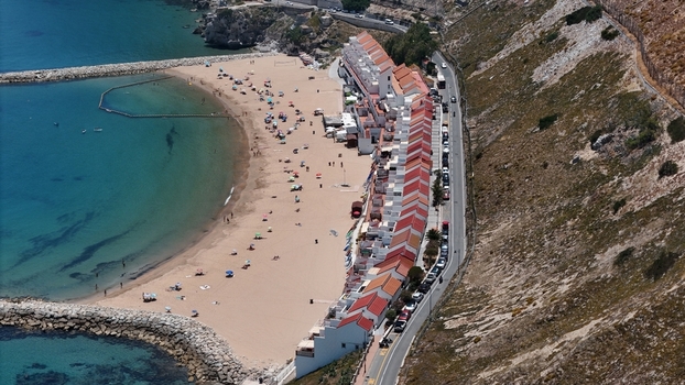 Gibraltar Gibraltar 02 July 2024 Aerial view of Sandy Bay with its distinctive colorful houses sandy beach and turquoise waters along the rocky coastline. Gibraltar Gibraltar 02 July 2024 Aerial view of Sandy Bay with its distinctive colorful houses sandy beach and turquoise waters along the rocky coastline.