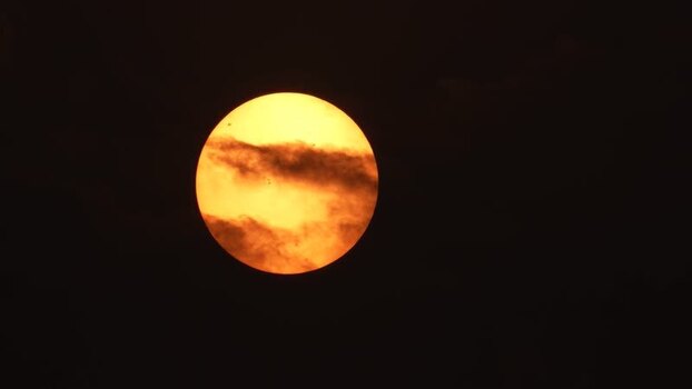 View of the sun partially obscured by clouds Bangladesh. View of the sun partially obscured by clouds Bangladesh.
