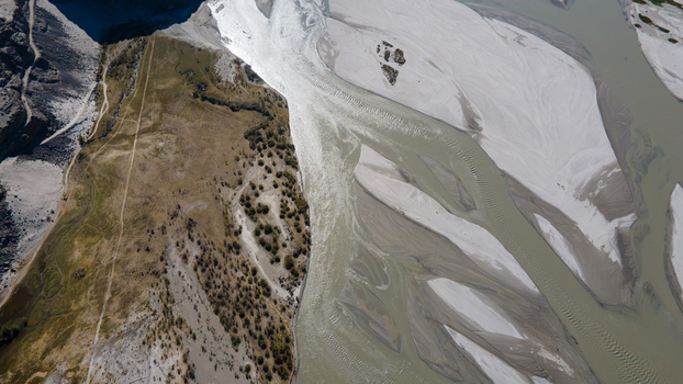 Aerial view of the Indus River with its braided channels and sandy banks flowing through the arid landscape of Skardu Gilgit Pakistan. Aerial view of the Indus River with its braided channels and sandy banks flowing through the arid landscape of Skardu Gilgit Pakistan.