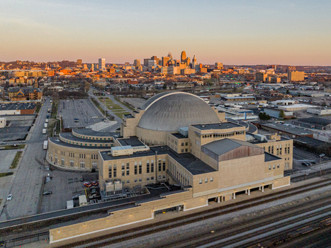 Aerial view of the beige Music Hall and the Union Terminal station standing majestically against the skyline s warm sunset hues Cincinnati Ohio United States. Aerial view of the beige Music Hall and the Union Terminal station standing majestically against the skyline s warm sunset hues Cincinnati Ohio United States.