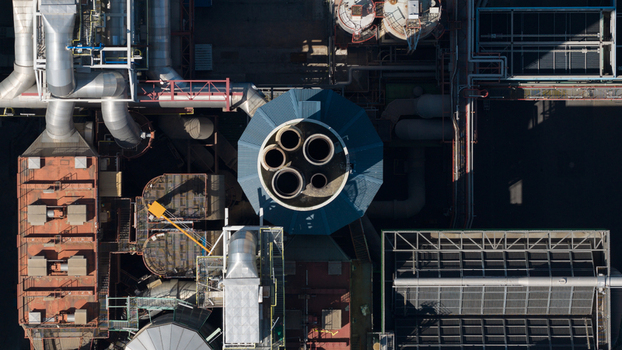 Aerial view of the Abfallkraftwerk Herten waste to energy plant with complex industrial piping chimneys and metal structures Herten Nordrhein Westfalen Germany.