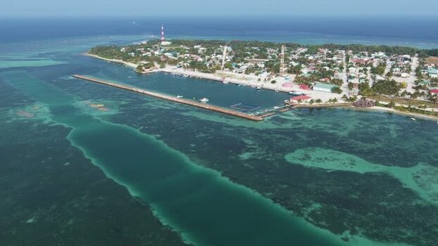 Aerial view of Makunudhoo island harbor and coral reefs Maldives. Aerial view of Makunudhoo island harbor and coral reefs Maldives.
