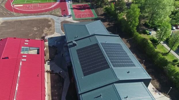 Aerial view of building with solar panels in Latvia.