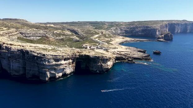 Aerial view of Dwejra Bay and limestone cliffs Malta. Aerial view of Dwejra Bay and limestone cliffs Malta.