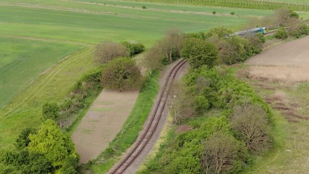 Aerial view of a train on a curved railway track Czechia.