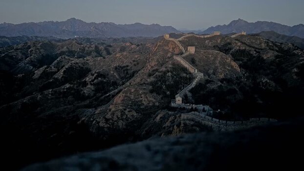 View of the Great Wall of China winding through mountains China.