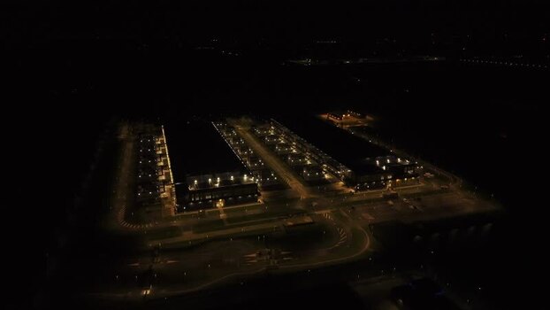 Aerial view of illuminated data center complex Netherlands.