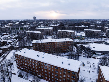 Aerial view of the Agenskalna priedes neighborhood with snow covered apartment blocks bare trees and quiet streets in Riga Latvia. Aerial view of the Agenskalna priedes neighborhood with snow covered apartment blocks bare trees and quiet streets in Riga Latvia.