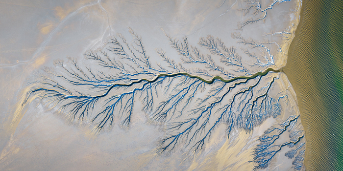 Aerial view of Reserva de la Biosfera Alto Golfo de California y Delta del Rio Colorado with intricate dendritic patterns of tidal channels in the sand Tijuana Baja California Mexico. Aerial view of Reserva de la Biosfera Alto Golfo de California y Delta del Rio Colorado with intricate dendritic patterns of tidal channels in the sand Tijuana Baja California Mexico.