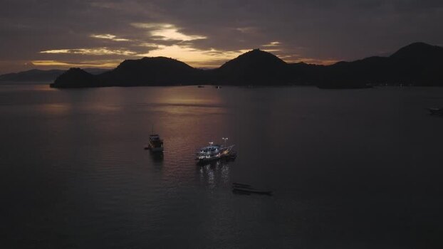 Aerial view of Pulau Kelor and boats at sunset Indonesia. Aerial view of Pulau Kelor and boats at sunset Indonesia.