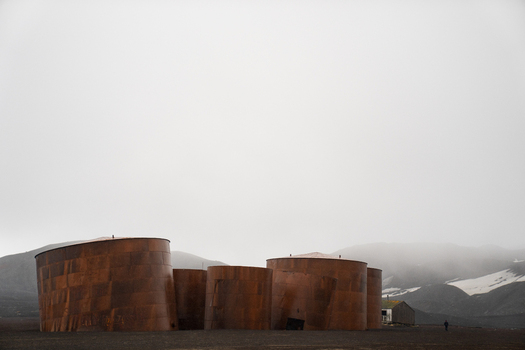 View of the historic rusted oil tanks at the abandoned whaling station on Deception Island Antarctica. View of the historic rusted oil tanks at the abandoned whaling station on Deception Island Antarctica.
