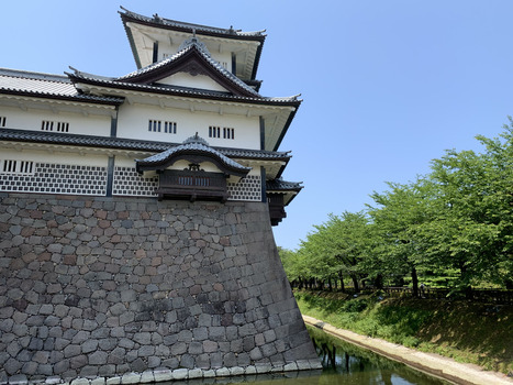 Japan 06 July 2026 View of the historic stone walls and white plastered walls of Kanazawa Castle surrounded by a moat and lush green trees under a clear blue sky in Japan. Japan 06 July 2026 View of the historic stone walls and white plastered walls of Kanazawa Castle surrounded by a moat and lush green trees under a clear blue sky in Japan.