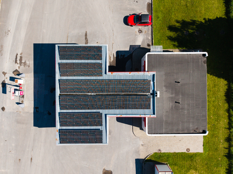 Aerial view of a commercial building with solar panels installed on the roof located near the Via Baltica road in Kekava Kekavas novads Latvia.