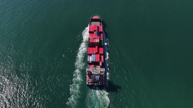 Aerial view of container ship sailing Portugal.