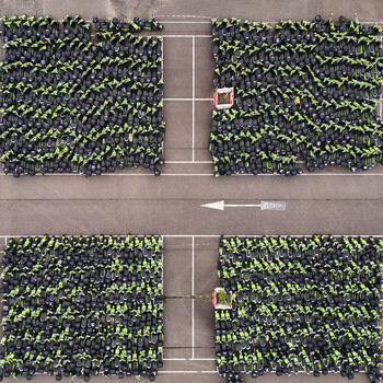 Middenmeer Netherlands 15 June 2026 Aerial view of thousands of GO Sharing electric scooters parked in dense blocks at a depot in Agriport after the company s business failure.