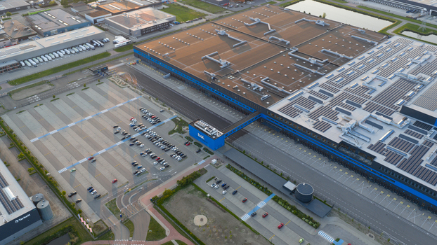 Waalwijk Netherlands 09 May 2026 Aerial view of the massive Bol.com distribution center featuring solar panels on rooftops and large parking lots in the industrial zone. Waalwijk Netherlands 09 May 2026 Aerial view of the massive Bol.com distribution center featuring solar panels on rooftops and large parking lots in the industrial zone.