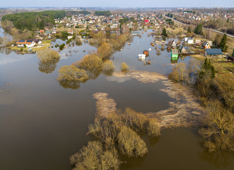 Kedainiai Lithuania 17 March 2026 Aerial view of flooded residential houses and gardens surrounded by trees and water under a clear sky. Kedainiai Lithuania 17 March 2026 Aerial view of flooded residential houses and gardens surrounded by trees and water under a clear sky.