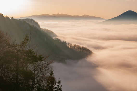 Aerial view of Sip in Mala Fatra mountain range with dense fog covering the valley at sunrise in Stankovany Zilina Region Slovakia. Aerial view of Sip in Mala Fatra mountain range with dense fog covering the valley at sunrise in Stankovany Zilina Region Slovakia.