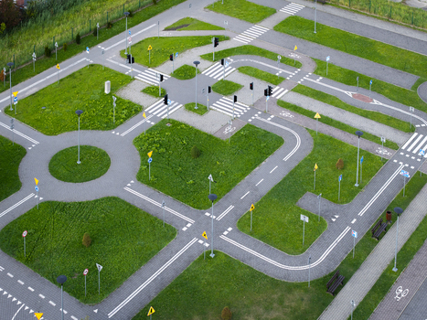 Aerial view of a traffic safety park for children featuring miniature roads roundabouts crosswalks and traffic signs set within a green park area in Wieliczka Lesser Poland Voivode Poland.