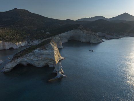 Aerial view of the dramatic white volcanic cliffs and turquoise waters of the Kleftiko coastline in Milos Greece. Aerial view of the dramatic white volcanic cliffs and turquoise waters of the Kleftiko coastline in Milos Greece.