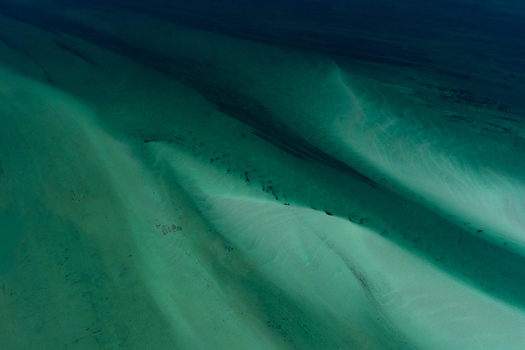 Aerial view of intricate turquoise ocean patterns and sandbars in the shallow coastal waters of Shire of Shark Bay Western Australia Australia. Aerial view of intricate turquoise ocean patterns and sandbars in the shallow coastal waters of Shire of Shark Bay Western Australia Australia.