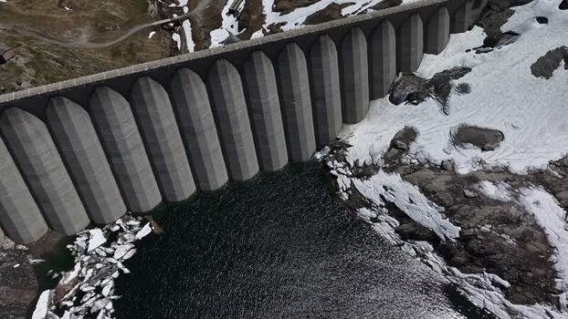 Aerial view of Lucendro Dam and snowy alpine terrain Switzerland. Aerial view of Lucendro Dam and snowy alpine terrain Switzerland.