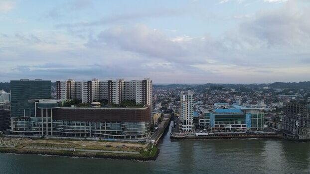 Aerial view of the modern coastal skyline and shopping complex in Balikpapan East Kalimantan Indonesia. Aerial view of the modern coastal skyline and shopping complex in Balikpapan East Kalimantan Indonesia.