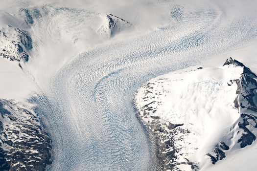 Aerial view of a glacier in the Kujalleq Municipality of Greenland. These glaciers are receding due to climate change.