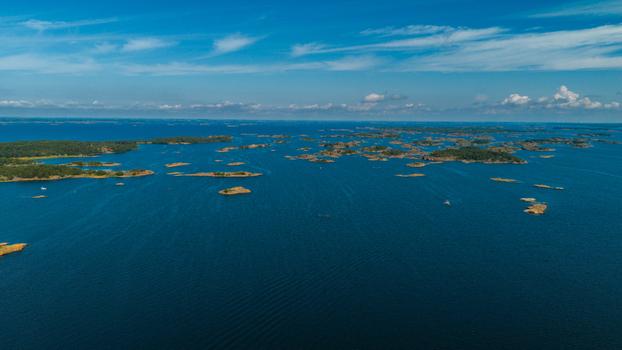 Aerial view of Oro Fortress Island surrounded by the vast blue waters of the Archipelago Sea with numerous small rocky islands under a clear sky in Oro Varsinais Suomi Finland. Aerial view of Oro Fortress Island surrounded by the vast blue waters of the Archipelago Sea with numerous small rocky islands under a clear sky in Oro Varsinais Suomi Finland.