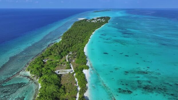 Aerial view of Fulhadhoo island and coral reefs Maldives. Aerial view of Fulhadhoo island and coral reefs Maldives.