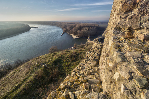 View of the ancient stone walls of Devin Castle overlooking the confluence of the Danube and Morava rivers in Bratislava IV Bratislava Region Slovakia. View of the ancient stone walls of Devin Castle overlooking the confluence of the Danube and Morava rivers in Bratislava IV Bratislava Region Slovakia.
