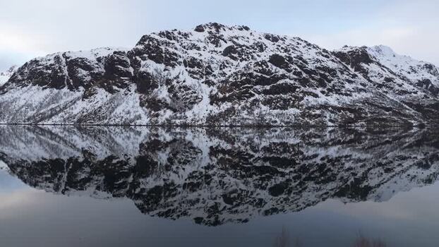 Aerial view of Lofoten mountains reflected in water Norway.