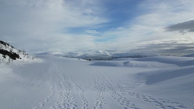 Aerial view of the snowy mountains of Kvaloya Norway.