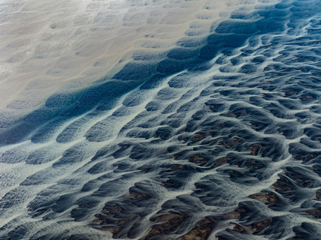 Aerial view of braided glacial rivers carve intricate patterns across the landscape a dance of icy blues and earthy browns creating a mesmerizing natural artwork Iceland Iceland. Aerial view of braided glacial rivers carve intricate patterns across the landscape a dance of icy blues and earthy browns creating a mesmerizing natural artwork Iceland Iceland.