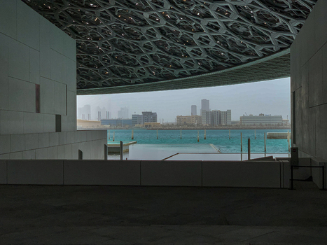 View of modern museum architecture featuring a complex geometric dome and waterfront in Dubai Dubai United Arab Emirates. View of modern museum architecture featuring a complex geometric dome and waterfront in Dubai Dubai United Arab Emirates.