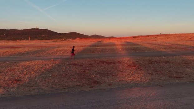 Aerial view of a runner in the dry landscape of Spain.