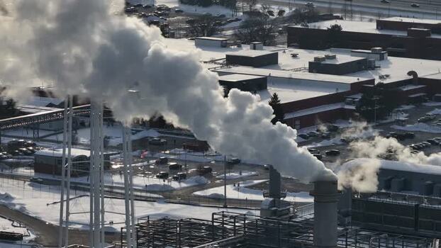 Aerial view of smoke rising from industrial chimneys in Reading United States. Aerial view of smoke rising from industrial chimneys in Reading United States.