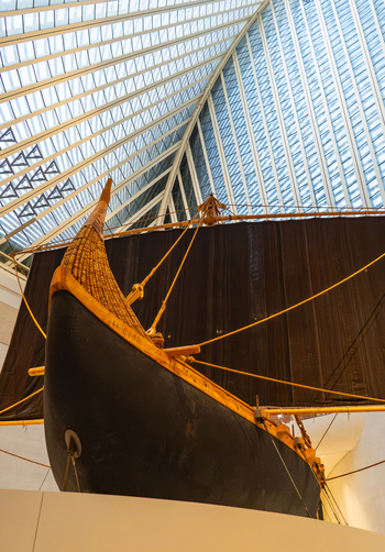 Abu Dhabi United Arab Emirates 03 August 2026 View of the traditional wooden dhow boat displayed inside the modern Zayed National Museum with its striking geometric glass roof.