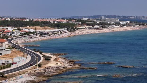 Aerial view of Carcavelos beach and coastal road Portugal.