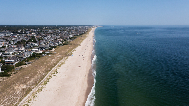 Aerial view of the sandy beach and residential houses along the coastline in Mantoloking New Jersey United States.