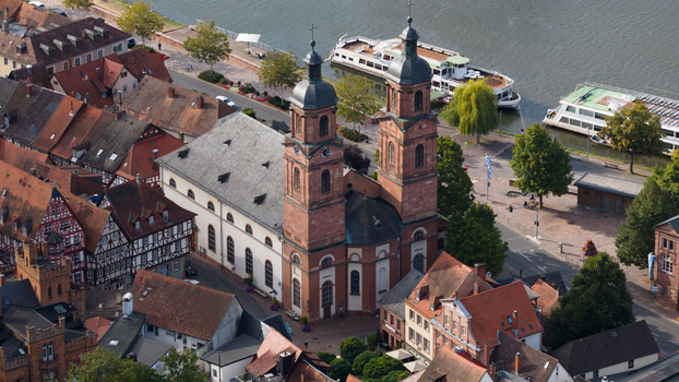 Aerial view of Stadtpfarrkirche St. Jakobus surrounded by historic half timbered houses and the Main river in Miltenberg Bayern Germany. Aerial view of Stadtpfarrkirche St. Jakobus surrounded by historic half timbered houses and the Main river in Miltenberg Bayern Germany.