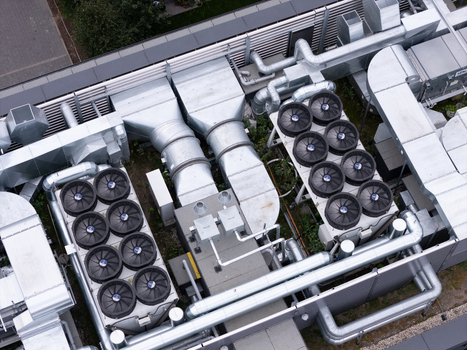Gdansk Poland 19 September 2026 Aerial view of industrial HVAC rooftop units with ventilation ducts and cooling fans on a commercial building. Gdansk Poland 19 September 2026 Aerial view of industrial HVAC rooftop units with ventilation ducts and cooling fans on a commercial building.