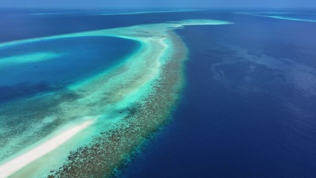 Aerial view of coral reefs and turquoise waters in Kendhoo Maldives. Aerial view of coral reefs and turquoise waters in Kendhoo Maldives.