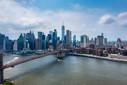 New York New York United States 11 August 2021 Aerial view of the Brooklyn Bridge spanning the East River with the Manhattan skyline and One World Trade Center.